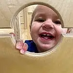Nose, Cheek, Smile, Skin, Lip, Chin, Eyebrow, Facial Expression, Mouth, Tooth, Baby, Happy, Gesture, Pink, Baby Laughing, Toddler, Window, Comfort, Fun, Child, Person