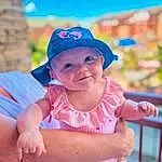 Face, Skin, Smile, Eyes, Facial Expression, Cap, Hat, Sky, Human Body, Happy, Pink, Baseball Cap, Body Of Water, Thigh, Baby & Toddler Clothing, Fun, Headgear, Sun Hat, Leisure, Toddler, Person, Headwear
