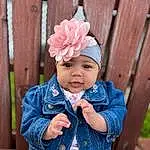 Clothing, Face, Skin, Eyes, Plant, Dress, Baby & Toddler Clothing, Textile, Sleeve, Cap, Baby, Wood, Pink, Hat, Happy, Headgear, Toddler, Flower, Grass, Child, Person, Headwear