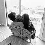 Photograph, Black, Window, Comfort, Kiss, Black-and-white, Gesture, Style, Happy, Monochrome, Black & White, Bag, Fun, Child, Sitting, Luggage And Bags, Room, Stock Photography, Person