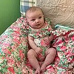 Cheek, Skin, Facial Expression, Comfort, Baby & Toddler Clothing, Textile, Neck, Sleeve, Pink, Toddler, Baby, Linens, Pattern, Grass, Child, Sitting, Magenta, Human Leg, Trunk, Person