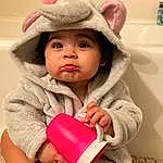 Cheek, Skin, Lip, Outerwear, Eyes, Facial Expression, White, Happy, Sleeve, Baby Playing With Toys, Standing, Baby & Toddler Clothing, Pink, Cap, Finger, Toddler, Fun, Wood, Baby, Child, Person, Headwear