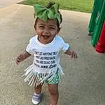 Head, Smile, Green, Sleeve, Baby & Toddler Clothing, Happy, Grass, T-shirt, Toddler, Baby, Recreation, Event, Fun, Child, Holiday, Leisure, Asphalt, Play, Person, Joy, Headwear