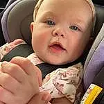 Cheek, Skin, Mouth, Comfort, Baby, Gesture, Finger, Baby & Toddler Clothing, Toddler, Child, Happy, Thumb, Car Seat, Baby Products, Auto Part, Nail, Sitting, Seat Belt, Luxury Vehicle, Head Restraint, Person