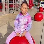 Face, Shoe, Photograph, Smile, White, Leg, Pink, Sneakers, Fun, Leisure, Shorts, Red, Public Space, Ball, Thigh, Magenta, Happy, Recreation, Child, Person, Joy