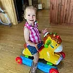 Wheel, Smile, Riding Toy, Wood, Baby & Toddler Clothing, Toy, Happy, Toddler, Fun, Leisure, Child, Baby, Hardwood, Toy Vehicle, Tire, Sitting, Baby Playing With Toys, Baby Toys, Play, Person, Joy