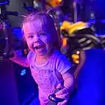 Face, Smile, Hand, Hairstyle, Purple, Human Body, Flash Photography, Entertainment, Gesture, Violet, Happy, Performing Arts, Toddler, Magenta, Leisure, Electric Blue, Fun, Event, Neon, Child, Person, Joy