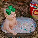Grass, Toy, Baby, Happy, Icing, Fun, Event, Plastic, Sweetness, Child, Soil, Toddler, Baby Products, Fictional Character, Baby Toys, Play, Sitting, Dessert, Sand, Buttercream, Person, Headwear