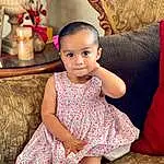 Face, Skin, Hairstyle, Eyes, Leg, Human Body, Fashion, Textile, Baby & Toddler Clothing, Pink, Flash Photography, Happy, Toddler, Child, Beauty, Couch, Day Dress, Sitting, Event, Fun, Person