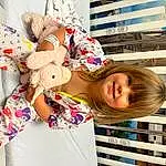 Smile, White, Building, Window, Toy, Happy, Pink, Child, Pattern, Doll, Leisure, Stuffed Toy, Plush, Carmine, Fun, Linens, Holiday, T-shirt, Selfie, Sunglasses, Person, Joy