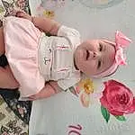 Face, Cheek, Skin, Eyes, Plant, Baby & Toddler Clothing, Sleeve, Baby, Flower, Pink, Toddler, Headgear, Comfort, Happy, Child, Hat, Rose, Petal, Thigh, Baby Products, Person, Headwear