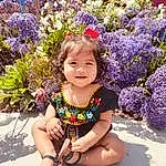 Flower, Smile, Plant, Photograph, Botany, Purple, Nature, Iris, People In Nature, Happy, Petal, Pink, Grass, Baby & Toddler Clothing, Summer, Toddler, Flower Arranging, Sandal, Magenta, Electric Blue, Person, Joy