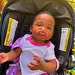 Skin, Eyes, Facial Expression, Baby Carriage, Black, Yellow, Baby & Toddler Clothing, Baby, Pink, Toddler, Comfort, Fun, Wheel, Recreation, Leisure, Child, Baby Products, Thigh, Person