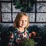 Hair, Plant, Smile, Facial Expression, Light, Leaf, Flash Photography, Window, Botany, Branch, Iris, Happy, Wood, Grass, Toddler, T-shirt, Fun, Tree, Christmas Ornament, Child, Person, Joy