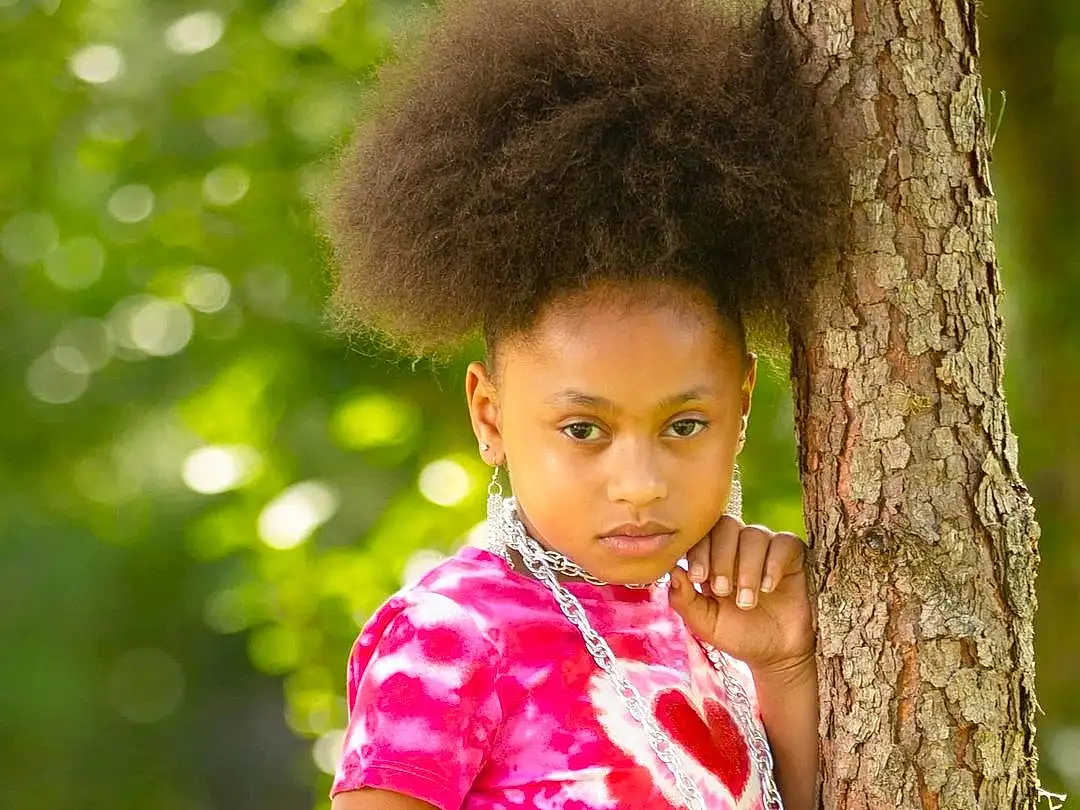 Face, Hair, Head, Eyes, People In Nature, Happy, Grass, Black Hair, Adaptation, Tree, Beauty, Child, Trunk, Toddler, Afro, Fun, Leisure, Furry friends, Portrait Photography, Forest, Person