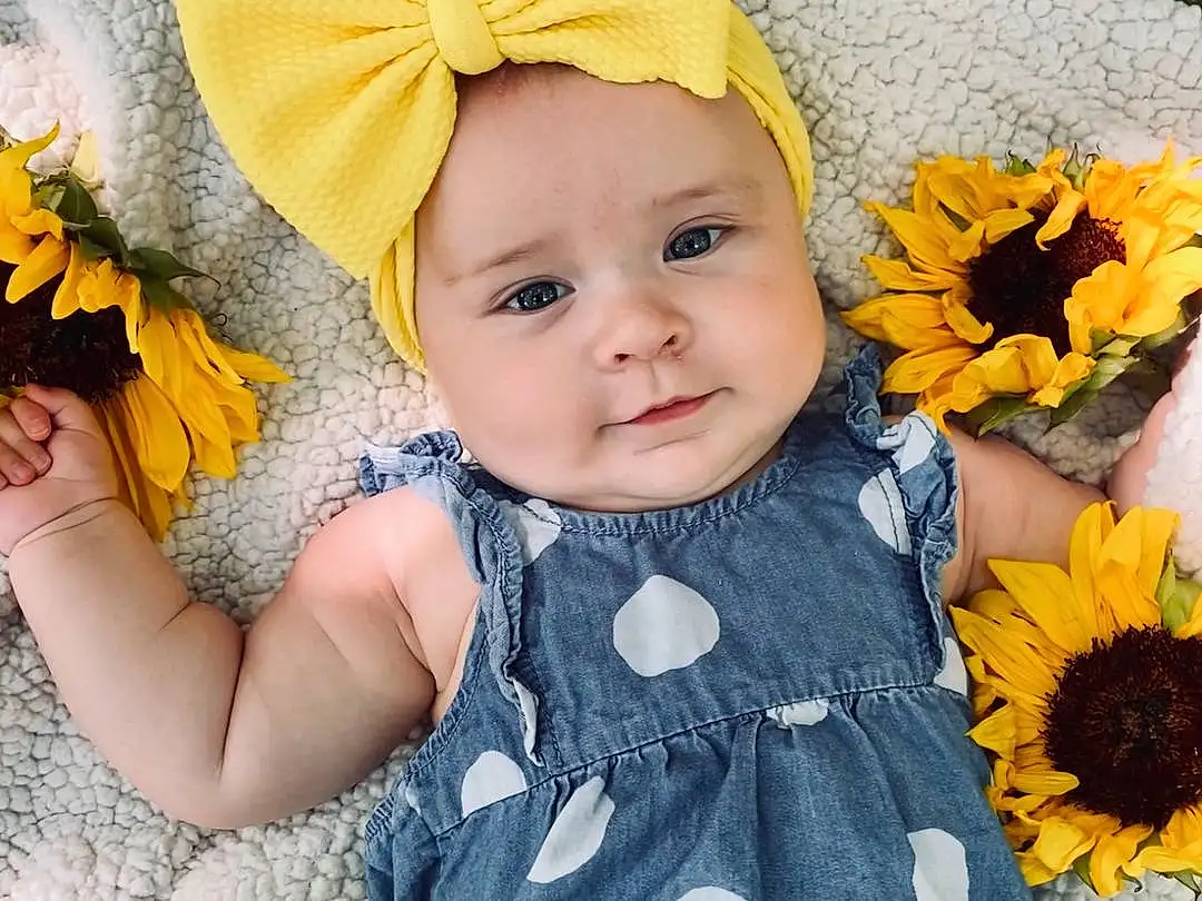 Flower, Skin, Outerwear, Photograph, Plant, Eyes, People In Nature, Blue, Green, Leaf, Petal, Baby & Toddler Clothing, Yellow, Textile, Orange, Dress, Happy, Iris, Toddler, Person, Headwear