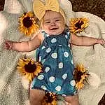Flower, Skin, Plant, Photograph, Smile, Petal, Leaf, Baby & Toddler Clothing, Dress, Textile, Yellow, Happy, Pink, Toddler, Baby, Pattern, Day Dress, Child, Beauty, Peach, Person, Joy, Headwear