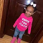 Clothing, Cheek, Outerwear, Black, Baby & Toddler Clothing, Sleeve, Pink, Wood, Material Property, Toddler, Wood Stain, Magenta, Flash Photography, T-shirt, Hardwood, Happy, Child, Varnish, Fun, Person, Joy