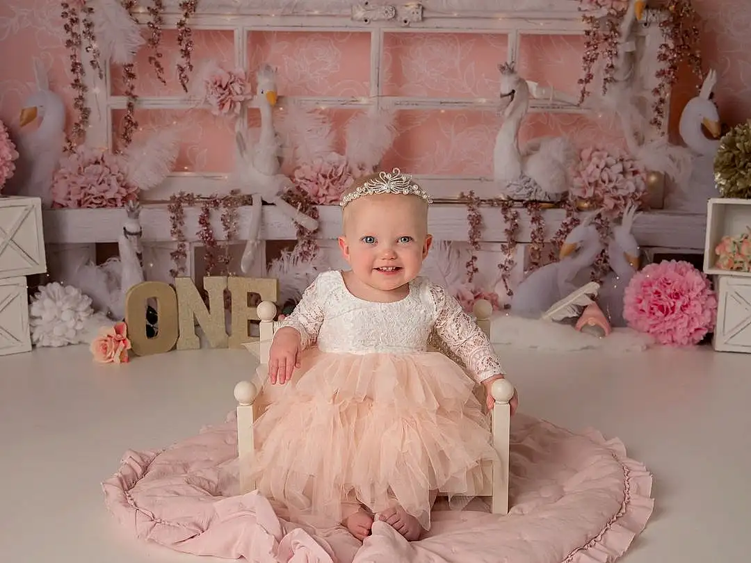 Smile, Dress, Pink, Bridal Clothing, Happy, Doll, Wedding Ceremony Supply, Gown, Embellishment, Petal, Bridal Party Dress, Baby, Headpiece, Event, Toddler, Toy, Peach, Sweetness, Ruffle, Person, Joy