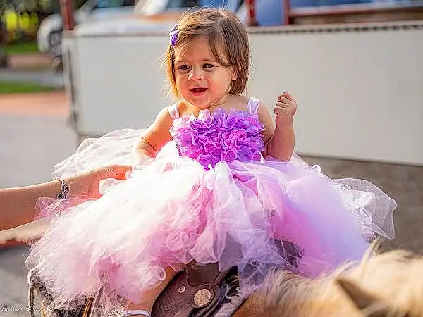 Smile, Dress, Purple, Ballerina tutu, Happy, Pink, Gown, Bridal Clothing, Entertainment, Dance, Headpiece, Toddler, Magenta, Event, Formal Wear, Wedding Ceremony Supply, Fun, Bridal Party Dress, Child, Ruffle, Person