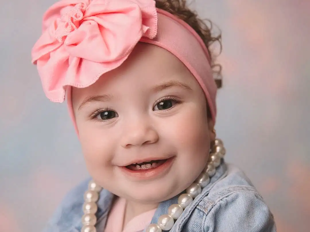 Clothing, Face, Hair, Cheek, Smile, Skin, Lip, Eyebrow, Eyes, Flash Photography, Sleeve, Happy, Cap, Pink, Toddler, Baby & Toddler Clothing, Cool, Headpiece, Baby, Beauty, Person, Joy, Headwear