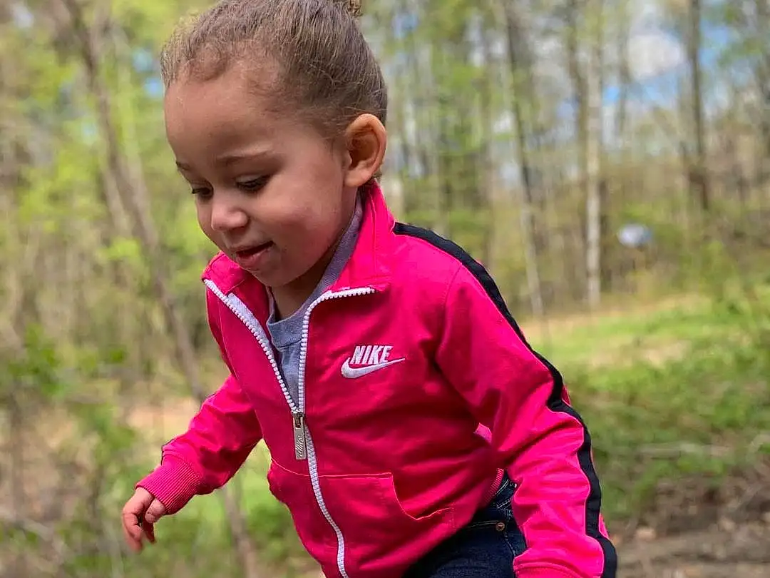 Face, Plant, Smile, People In Nature, Tree, Sleeve, Happy, Toddler, Grass, Baby & Toddler Clothing, Leisure, Wood, T-shirt, Landscape, Recreation, Soil, Walking, Magenta, Fun, Forest, Person