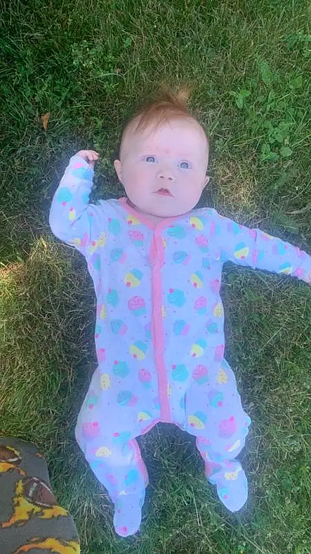 Face, Head, Eyes, People In Nature, Leaf, Baby & Toddler Clothing, Sleeve, Iris, Pink, Grass, Toddler, Finger, Baby, Fun, Smile, Happy, Pattern, Electric Blue, Child, Thumb, Person