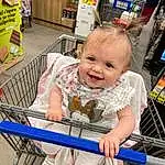 Clothing, Skin, Smile, Shopping Cart, Toddler, Public Space, Baby & Toddler Clothing, Baby, Leisure, Fun, Child, Cart, Customer, Happy, Convenience Store, Retail, Shopping, Shelf, Tire, Person