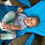 Joint, Smile, Comfort, Leisure, Grass, Baby, Toddler, Fun, Happy, Child, Recreation, Event, Electric Blue, Baby Products, Sitting, Infant Bed, Vacation, Lap, Bag, Tree, Person, Joy