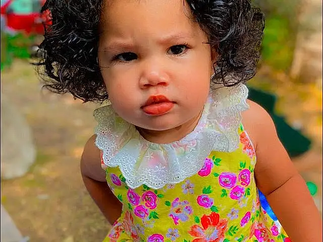 Face, Skin, Head, Hairstyle, Photograph, Facial Expression, Dress, Happy, Baby & Toddler Clothing, People In Nature, Sleeve, One-piece Garment, Pink, Toddler, Grass, Day Dress, Adaptation, Fun, Child, Beauty, Person