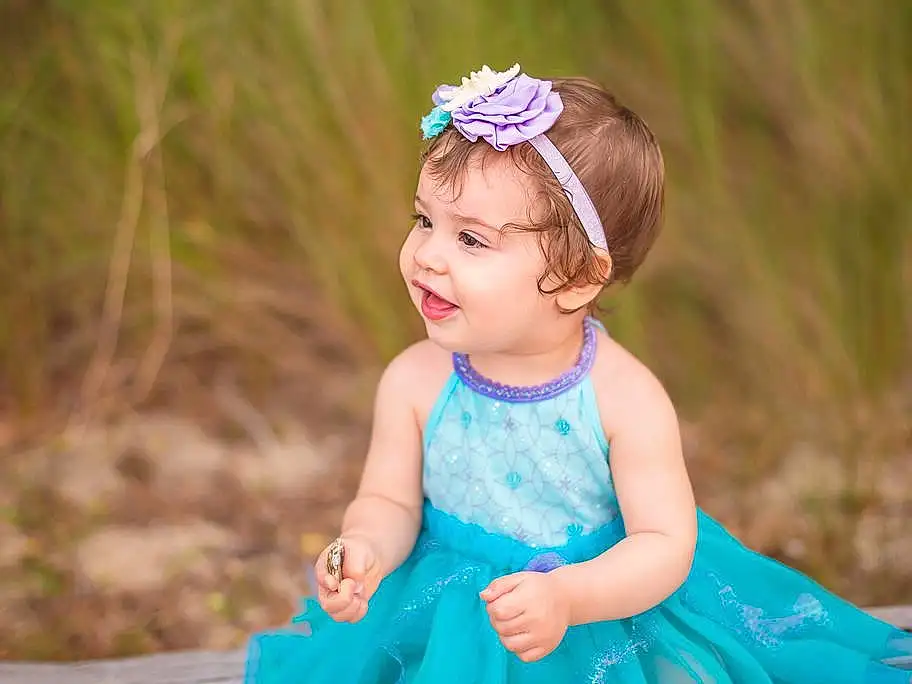Clothing, Skin, Photograph, Smile, Green, Leaf, Nature, Purple, Azure, Dress, People In Nature, Happy, Flash Photography, Grass, Baby & Toddler Clothing, Iris, Pink, Fun, Aqua, Toddler, Person
