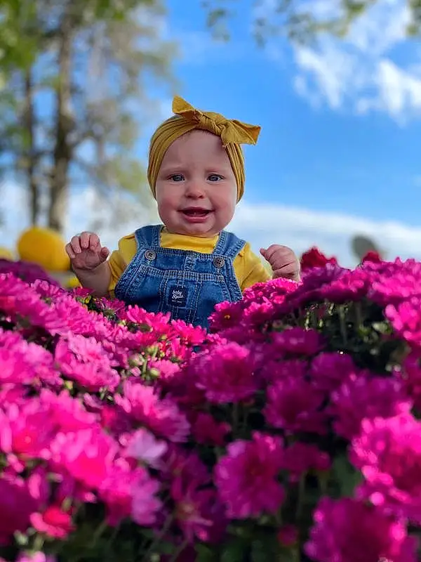Flower, Smile, Plant, Sky, Cloud, Petal, Nature, People In Nature, Happy, Pink, Baby & Toddler Clothing, Grass, Tree, Magenta, Toddler, Flowering Plant, Leisure, Baby, Shrub, Annual Plant, Person, Joy, Headwear