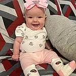 Skin, Head, Smile, Facial Expression, White, Baby & Toddler Clothing, Human Body, Sleeve, Pink, Comfort, Cap, Thigh, Baby, Fun, Happy, Knee, Lap, Toddler, Red, Child, Person, Joy, Headwear