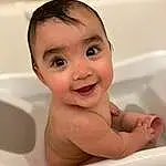 Cheek, Skin, Baby Bathing, Hand, Bathtub, Smile, Eyes, Human Body, Bathroom, Fluid, Iris, Bathing, Water, Toddler, Baby, Plumbing, Happy, Plumbing Fixture, Thumb, Fun, Person