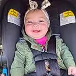 Smile, White, Seat Belt, Happy, Comfort, Car Seat, Vroom Vroom, Toddler, Baby, Child, Auto Part, Baby Carriage, Baby In Car Seat, Baby & Toddler Clothing, Fun, Car Seat Cover, Baby Products, Family Car, Vehicle Door, Fashion Accessory, Person, Joy, Headwear