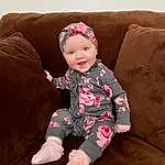 Head, Smile, Eyes, Leg, Baby & Toddler Clothing, Comfort, Human Body, Sleeve, Couch, Baby, Thigh, Toddler, Knee, Sock, Happy, Costume Hat, Lap, Human Leg, Pattern, Foot, Person, Headwear