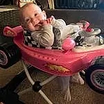 Wheel, Head, Tire, Human Body, Riding Toy, Smile, Baby & Toddler Clothing, Vehicle, Baby, Comfort, Toddler, Happy, Automotive Tire, Toy, Fun, Child, Baby Products, Sitting, Vroom Vroom, Person