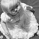Head, Hairstyle, Dress, Gesture, Black-and-white, Style, Happy, Toddler, Monochrome, Black & White, Baby & Toddler Clothing, Human Leg, Baby, Blond, Event, Child, Sitting, Flash Photography, Fun, Person