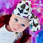Plant, Purple, Sleeve, Baby & Toddler Clothing, Pink, Headgear, Violet, Happy, Baby, Costume Hat, Magenta, Cap, Toddler, Petal, Pattern, Fashion Accessory, Furry friends, Event, Art, Hat, Person, Headwear