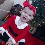 Smile, Christmas Tree, White, Human Body, Happy, Red, Lap, Costume Hat, Toddler, Fun, Hat, Event, Holiday, Thigh, Santa Claus, Fictional Character, Christmas, Child, Chair, Costume, Person, Joy