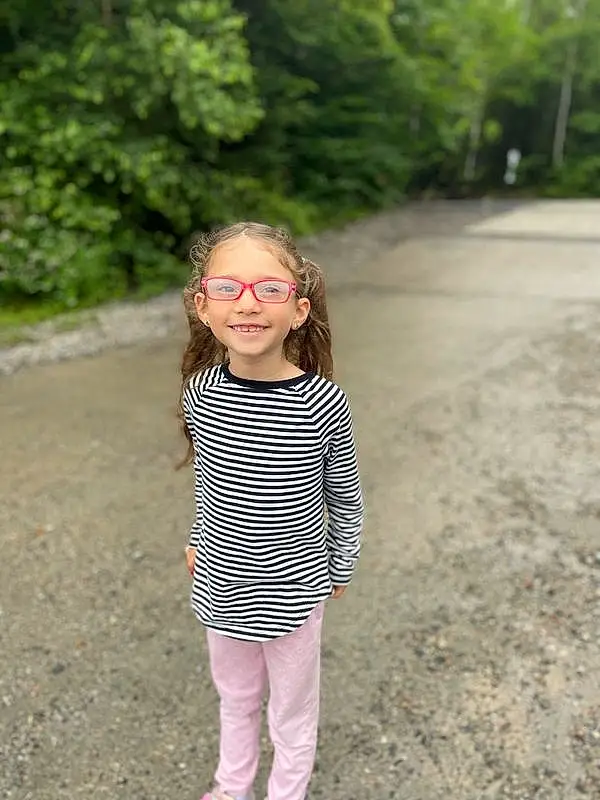 Face, Smile, People In Nature, Plant, Tree, Sleeve, Asphalt, Happy, Grass, Road Surface, Eyewear, Fun, Toddler, Recreation, Blond, Pattern, Forest, Soil, Leisure, Landscape, Person, Joy