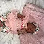 Skin, Hand, Comfort, Dress, Human Body, Textile, Baby & Toddler Clothing, Pink, Finger, Baby, Baby Sleeping, Toddler, Linens, Pattern, Room, Bedding, Abdomen, Sunglasses, Person, Headwear