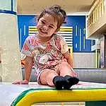 Smile, Blue, Fun, Leisure, Toddler, Playground, Baby Playing With Toys, Recreation, Outdoor Play Equipment, Child, T-shirt, Happy, Thigh, Human Leg, Play, Sitting, Room, Games, Knee, Playground Slide, Person, Joy