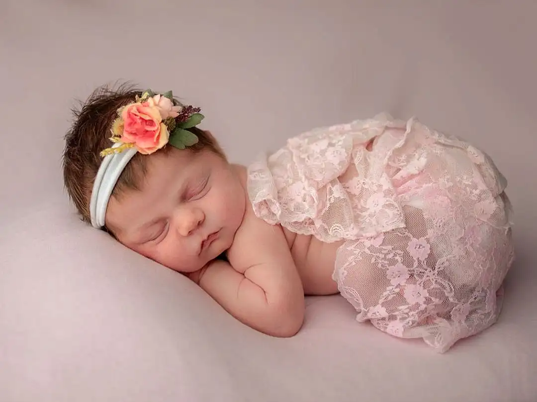 Face, Skin, Baby & Toddler Clothing, Flower, Textile, Comfort, Flash Photography, Baby, Petal, Pink, Headgear, Toddler, Headpiece, Headband, Hair Accessory, Baby Sleeping, Child, Embellishment, Fashion Accessory, Jewellery, Person