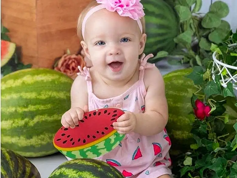 Head, Flower, Smile, Plant, Photograph, Citrullus, Food, Green, Watermelon, Baby & Toddler Clothing, Squash, Natural Foods, Grass, Happy, Baby, Toddler, Melon, Beauty, Fruit, Person, Headwear