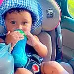 Skin, Blue, Azure, Human Body, Finger, Toddler, Baby & Toddler Clothing, Plastic Bottle, Thigh, Baby, Comfort, Electric Blue, Fun, Thumb, Car Seat Cover, Nail, Happy, Steering Wheel, Cap, Baby Products, Person, Headwear