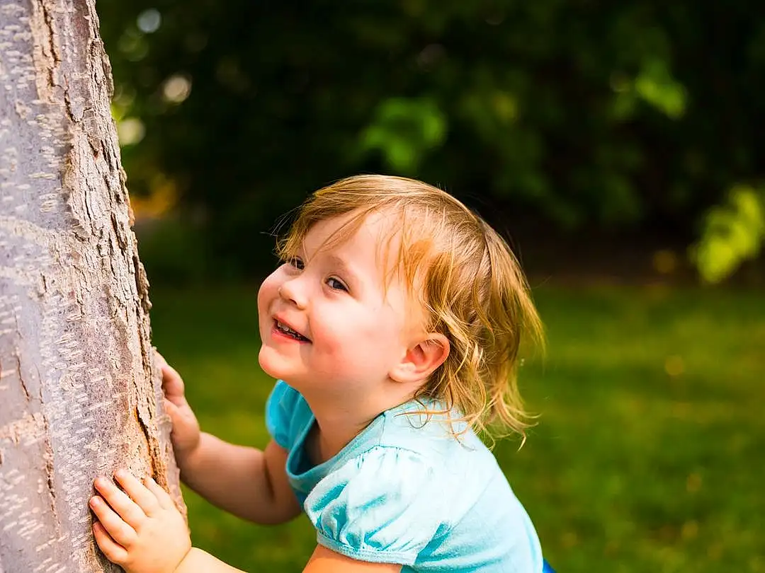 Head, Smile, Eyes, People In Nature, Happy, Gesture, Grass, Flash Photography, Leisure, Wood, Fun, Toddler, Trunk, Tree, Recreation, Baby, Blond, Child, Sitting, Person, Joy