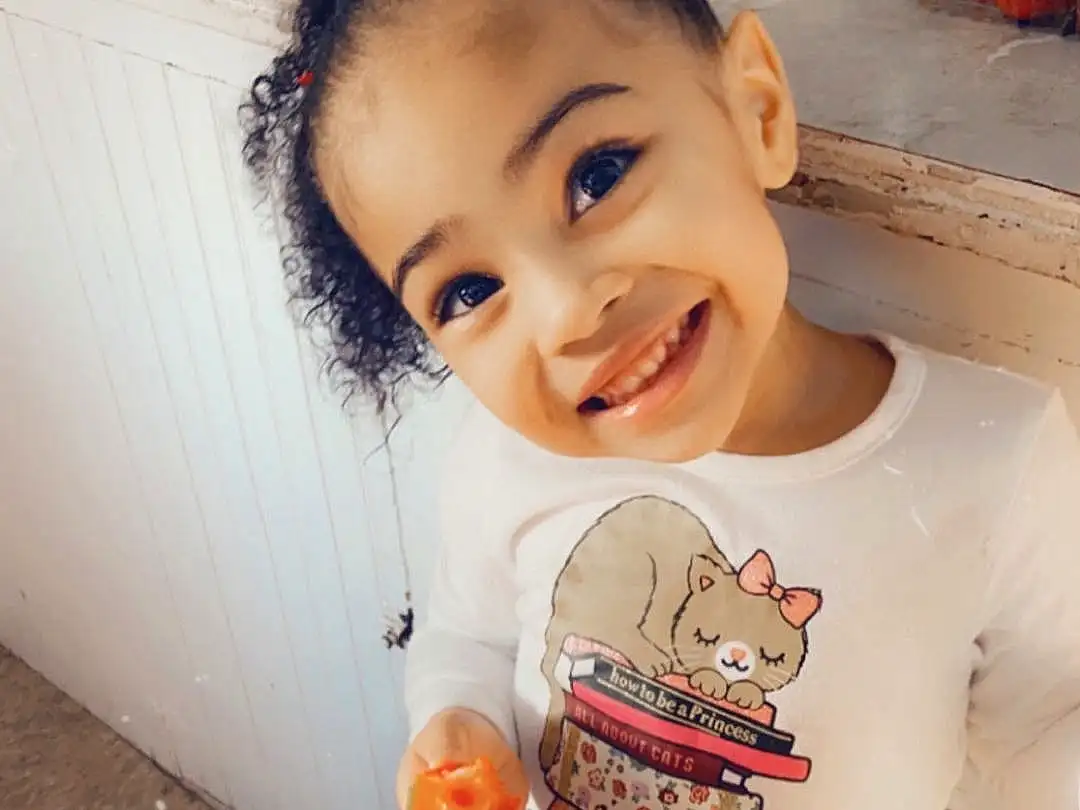 Skin, Head, Smile, Hand, Hairstyle, Eyes, Baby & Toddler Clothing, Human Body, Neck, Sleeve, Orange, Standing, Happy, T-shirt, Toddler, Child, Baby, Toy, Fun, Person, Joy