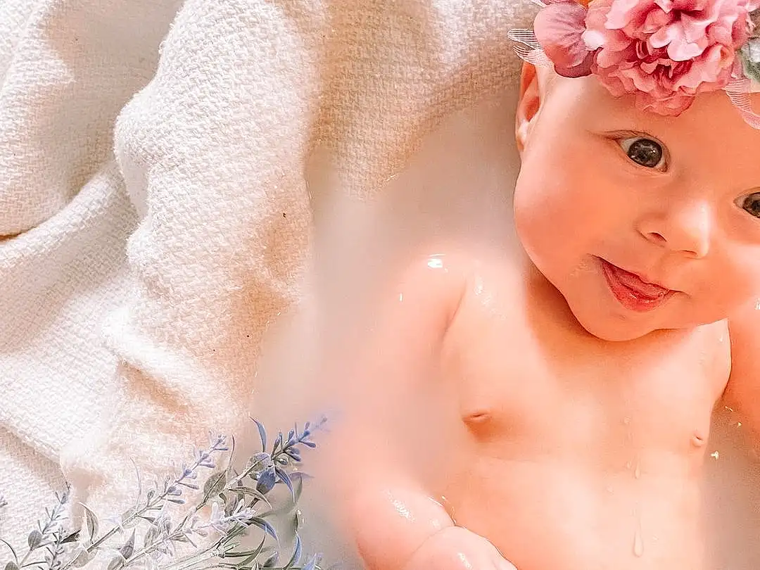 Skin, Hand, Baby Bathing, Smile, White, Muscle, Finger, Pink, Baby & Toddler Clothing, Happy, Eyelash, Bathing, Toddler, Baby, Chest, Petal, Beauty, Bathroom, Child, Close-up, Person, Headwear
