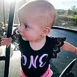 Cheek, Skin, Joint, Lip, Hand, Hairstyle, Shoulder, Facial Expression, Black, Neck, Sleeve, Baby & Toddler Clothing, Iris, Standing, Happy, Baby, Finger, Pink, Person